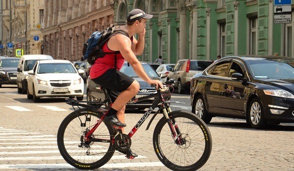 cyclist talking on his cell phone